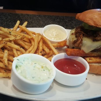 Fuzio Universal Bistro - A burger w/Firecracker pork, cheese, avocado & Habenero aioli all sitting on Siracha fries. Served w/hot, crisp herbed fries. Mm mm mm! - New American Near Me - Modesto, California Fuzio Universal Bistro - A burger w/Firecracker pork, cheese, avocado & Habenero aioli all sitting on Siracha fries. Served w/hot, crisp herbed fries. Mm mm mm! - New American Near Me - Modesto, California