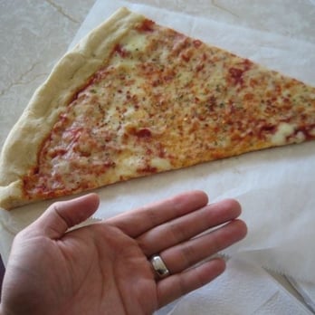 Ljubo Pizzeria - March 2008: this is a really big slice for $2.50. (I am not a midget with small hands either.) - Pizza Near Me - Bronx, New York