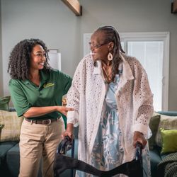 Home Instead - Home Instead Care Giver and their client in a lounge