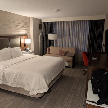 Hampton Inn & Suites Chicago-Downtown - Hotel room with a king bed and softa - Hotels Near Me - Chicago, Illinois Hampton Inn & Suites Chicago-Downtown - Hotel room with a king bed and softa - Hotels Near Me - Chicago, Illinois