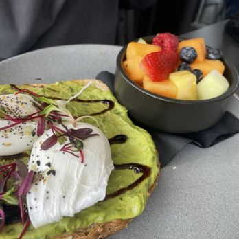 The Liberty Tavern - Avocado Everything Toast and fruit Side Fruit - Bars Near Me - Arlington, Virginia