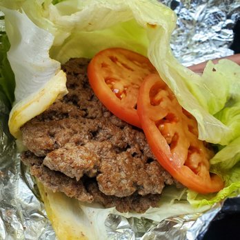 Five Guys - a hamburger with lettuce and tomatoes - Burgers Near Me - Wheaton, Illinois