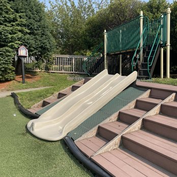 Magnolia Cooperative Preschool - Playground slides + little library on the playground - Preschools Near Me - Seattle, Washington Magnolia Cooperative Preschool - Playground slides + little library on the playground - Preschools Near Me - Seattle, Washington
