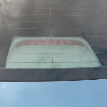 GG Window Tinting - This guy works with his eyes closed apparently that looks good to him.... Horrible cut - Car Window Tinting Near Me - Riverside, California