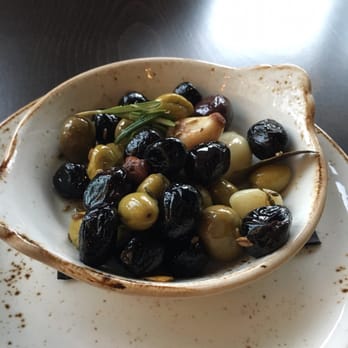 Woodblock - Herb roasted olives. - Cocktail Bars Near Me - Redmond, Washington