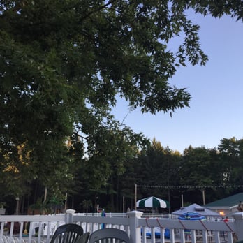 Pine Grove Campground & RV Park - A great deck area with umbrellas and picnic tables. Next to a pool with good quality lounging chairs. - Campgrounds Near Me - Shawano, Wisconsin Pine Grove Campground & RV Park - A great deck area with umbrellas and picnic tables. Next to a pool with good quality lounging chairs. - Campgrounds Near Me - Shawano, Wisconsin