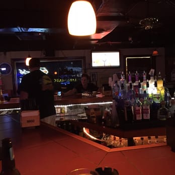 Smugglers Tavern - a bar with alcohol bottles on the counter - Sports Bars Near Me - Tierra Verde, Florida Smugglers Tavern - a bar with alcohol bottles on the counter - Sports Bars Near Me - Tierra Verde, Florida
