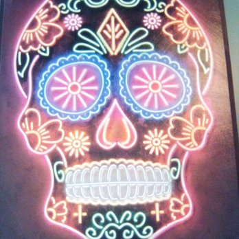 Locals Tacos and Tequila - a neon skull - Mexican Near Me - West Springfield, Virginia