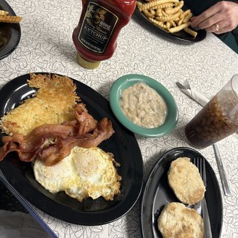Olivette Diner - The number 4 breakfast with over medium eggs, bacon, and a biscuit instead of toast with a side of gravy. - Diners Near Me - Saint Louis, Missouri