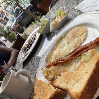 La Flor - Home fries, bacon, eggs over medium well, toast & my wife had the huevos rancheros. - Mexican Near Me - Woodside, New York La Flor - Home fries, bacon, eggs over medium well, toast & my wife had the huevos rancheros. - Mexican Near Me - Woodside, New York