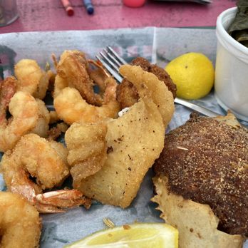 Singleton's Seafood Shack - 1/2 of the Combo plate! The greens are delish, triggerfish, deviled crab yum! Shrimp was DEVEINED! The hush puppy, best I've eaten! - Seafood Near Me - Jacksonville, Florida Singleton's Seafood Shack - 1/2 of the Combo plate! The greens are delish, triggerfish, deviled crab yum! Shrimp was DEVEINED! The hush puppy, best I've eaten! - Seafood Near Me - Jacksonville, Florida
