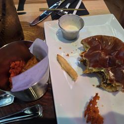 Rock & Brews - Oklahoma Burger. Recommend asking them to cook to your preferred level as they come well done unless you ask for medium, medium well, etc.
