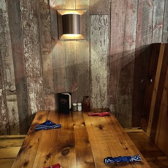 Dotzy’s Restaurant and Saloon - a wooden table with knives on it - American Near Me - Elgin, Iowa