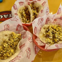 Fuzzy's Taco Shop - Two Chorizo, Potatoes, Egg, & Cheese Taco(top), Chorizo, Egg, & Cheese Taco(left), Bacon, Egg, & Cheese Taco(Right). Yum.