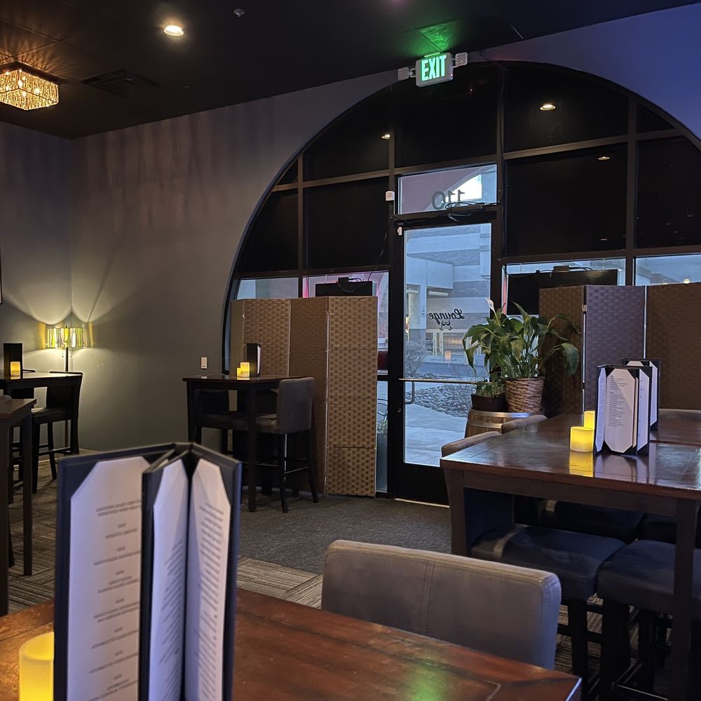 a view of a dining area with tables and chairs a view of a dining area with tables and chairs
