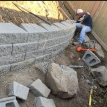 Tellez Landscape - a man working on a retaining wall - Junk Removal & Hauling Near Me