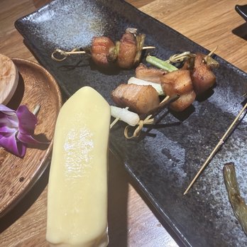 Sushi Damu - banana melona and pork skewer for garnish. - Sushi Bars Near Me - Tustin, California Sushi Damu - banana melona and pork skewer for garnish. - Sushi Bars Near Me - Tustin, California