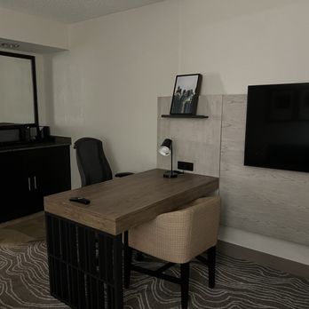 Embassy Suites by Hilton Phoenix Tempe - Desk area with television in living room type space - Hotels Near Me - Tempe, Arizona Embassy Suites by Hilton Phoenix Tempe - Desk area with television in living room type space - Hotels Near Me - Tempe, Arizona
