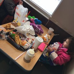 two children eating at a table two children eating at a table