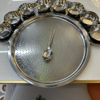 Maharaja Bhog - a clock made out of bowls - Indian Near Me - Mississauga, Ontario Maharaja Bhog - a clock made out of bowls - Indian Near Me - Mississauga, Ontario