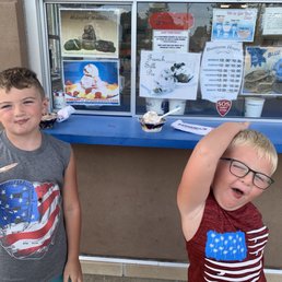 two boys eating ice cream two boys eating ice cream