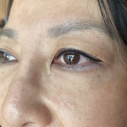 Eyeliners tatoo with little wing