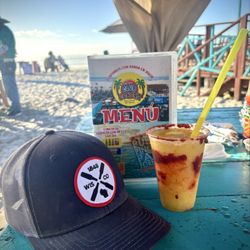 Club Corona - A menu, a Wisconsin cap and a mango margarita