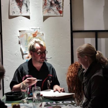 The Warzone Centre - Artist Jamie Harper painting at The Centre (image courtesy of Giros Cafe FB page). - Cultural Center Near Me - Belfast, BFS