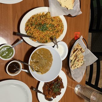 Himalayan Cuisine - a variety of dishes on a wooden table - Indian Near Me - Concord, California