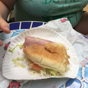 George's Pizza and Subs - a child eating a sub - Salad Near Me - West Brookfield, Massachusetts George's Pizza and Subs - a child eating a sub - Salad Near Me - West Brookfield, Massachusetts