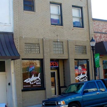 Sharkeez - a blue pick up truck parked in front of a building - Pubs Near Me - Lees Summit, Missouri