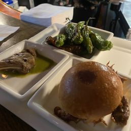 Tapas bites: shishito peppers, lamb lollipop and duck slider Tapas bites: shishito peppers, lamb lollipop and duck slider