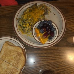 Spinach & sausage scramble with fresh fruit and sourdough toast. Spinach & sausage scramble with fresh fruit and sourdough toast.