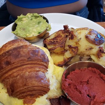 Sugar and Scribe - Posh pig in croissant - egg, bacon, jack cheese, with avocado and tomato pesto - Bakeries Near Me - La Jolla, California Sugar and Scribe - Posh pig in croissant - egg, bacon, jack cheese, with avocado and tomato pesto - Bakeries Near Me - La Jolla, California