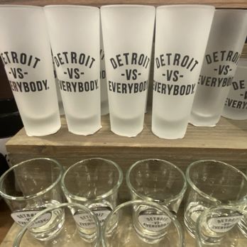 Michigan Treasures - a row of shot glasses on a shelf - Convenience Stores Near Me - Romulus, Michigan