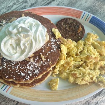 Juno Beach Cafe - Banana Walnut Pancakes Combo Breakfast (scrambled eggs & turkey sausage) - Breakfast & Brunch Near Me - Juno Beach, Florida