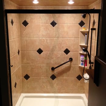 Re-Bath - a shower with tiled walls and floor - General Contractors Near Me - Paducah, Kentucky