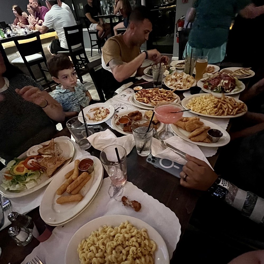 Greg's Tavern - a table full of food - Pizza Near Me - Beverly, Massachusetts Greg's Tavern - a table full of food - Pizza Near Me - Beverly, Massachusetts