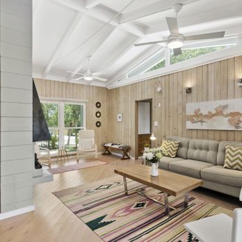 Aeon Enterprises - a living room with wood paneling - Door Sales/Installation Near Me Aeon Enterprises - a living room with wood paneling - Door Sales/Installation Near Me