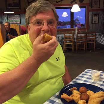David's Catfish House - Me biting in... - Seafood Near Me - Atmore, Alabama