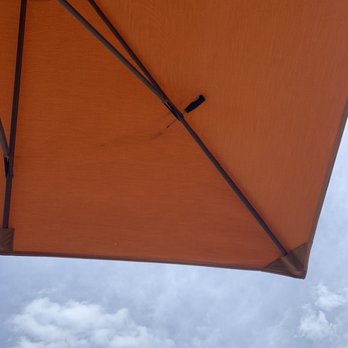 Cape Cod  Coffee - n orange umbrella with a blue sky in the background - Coffee & Tea Near Me - Mashpee, Massachusetts