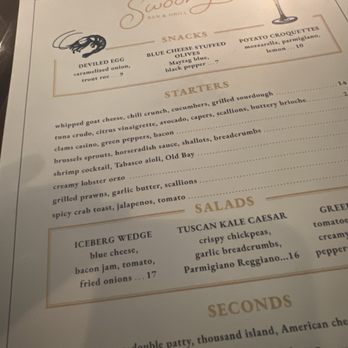 Swoony's - Menu - The menu lists various food options including deviled eggs, blue cheese stuffed olives, potato croquettes, and multiple starters and salads. - New American Near Me - Brooklyn, New York