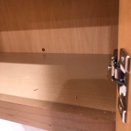 Unprofessional installation of kitchen cabinets. Missed structural members. Sloppy work.