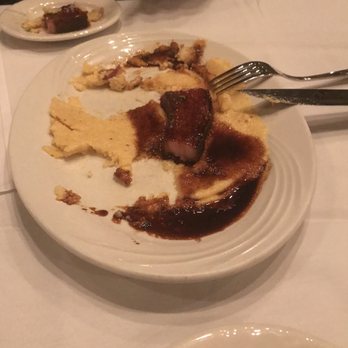 Morrie's Steakhouse - Slab bacon appetizer with bbq gastrique sauce over jalapeño grits. - American Near Me - Sioux Falls, South Dakota