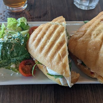 Postino Grant - This is the chicken and mozzarella panini with a side salad. - Wine Bars Near Me - Tucson, Arizona Postino Grant - This is the chicken and mozzarella panini with a side salad. - Wine Bars Near Me - Tucson, Arizona