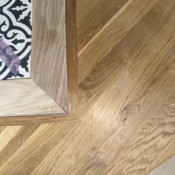 HBZ - Cracked wood trim and scratches on hardwood floor - General Contractors Near Me - Seattle, Washington HBZ - Cracked wood trim and scratches on hardwood floor - General Contractors Near Me - Seattle, Washington