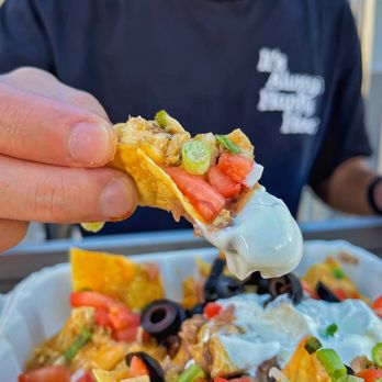 Jimboy's Tacos - a hand holding a tortilla - Mexican Near Me - Elk Grove, California Jimboy's Tacos - a hand holding a tortilla - Mexican Near Me - Elk Grove, California
