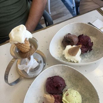 Mado - Mastic (w/cone), sour cherry, pistachio, marionberry in bottom left bowl, marionberry, chocolate orange and plain in top right bowl. - Desserts Near Me - Kuşadası, 09 Mado - Mastic (w/cone), sour cherry, pistachio, marionberry in bottom left bowl, marionberry, chocolate orange and plain in top right bowl. - Desserts Near Me - Kuşadası, 09