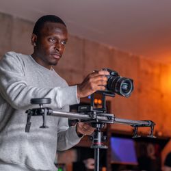 In-Gear Media - Photographer setting up a camera for a product shoot and video production session