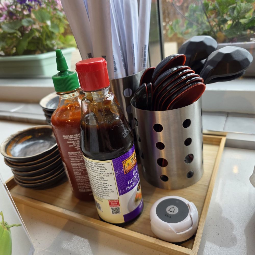 Pho Ngon Dat Viet - Neatly organized utensils, sauce plates, sauce and the bell for service - Vietnamese Near Me - Markham, Ontario Pho Ngon Dat Viet - Neatly organized utensils, sauce plates, sauce and the bell for service - Vietnamese Near Me - Markham, Ontario